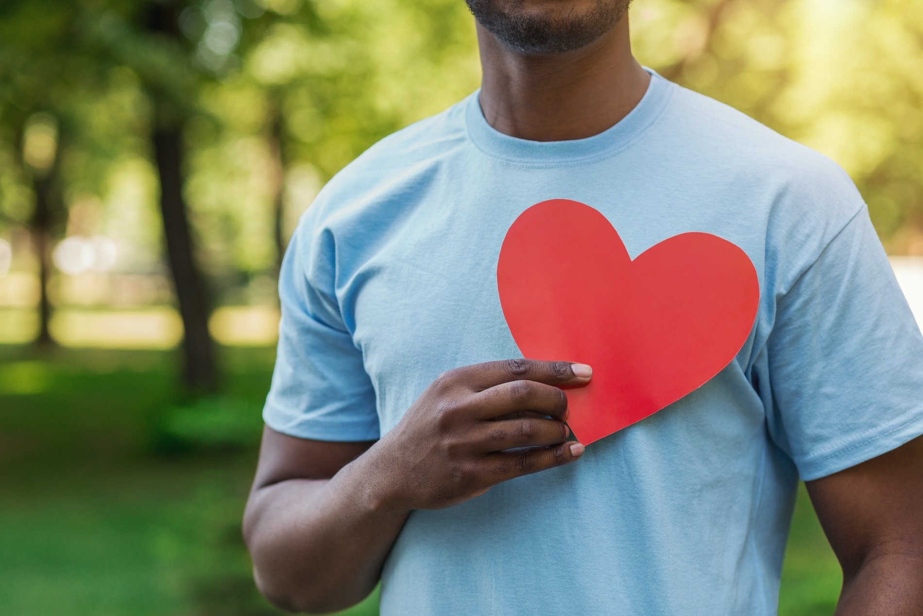 man holding heart